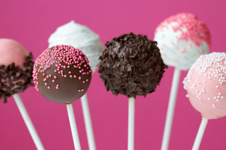 Chocolate, Vanilla and Strawberry Cakesicle on sticks lifestyle image