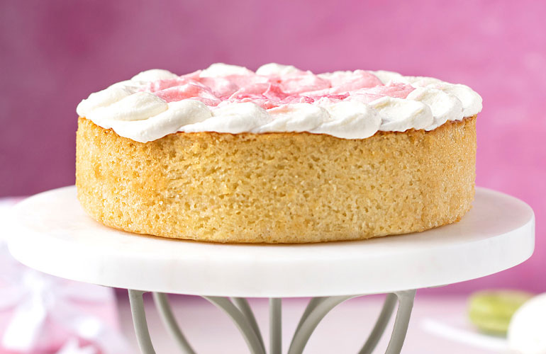 A Pillsbury Vanilla cake sitting on top of a table.