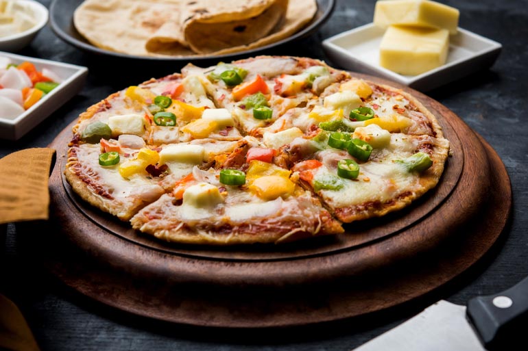 Roti Pizza on a plate lifestyle image