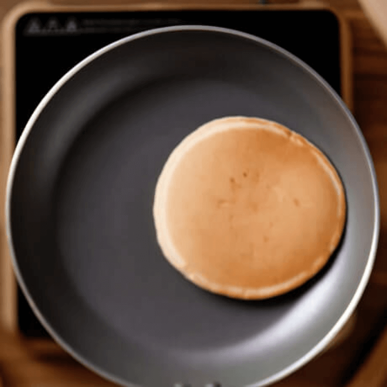 Light brown pancake in a pan