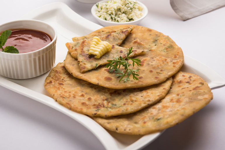 Stuffed Paratha on a plate lifestyle image