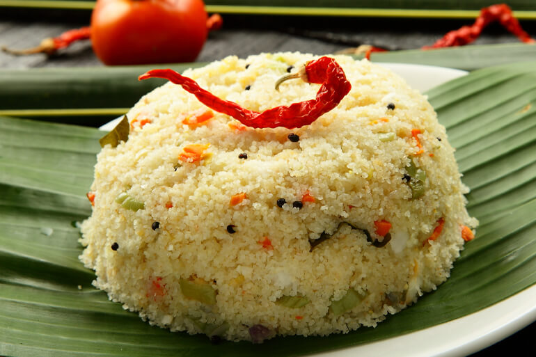 Finished recipe for UPMA on a white plate