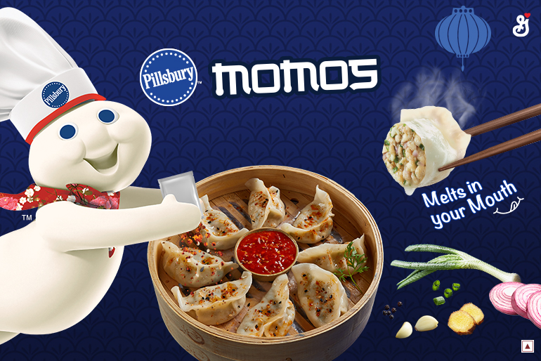 The Pillsbury Doughboy coming out of the side pouring Magic Momo Masala seasoning on a bowl of Chicken Delight Momos with the text reading, "Momos, melts in your mouth"